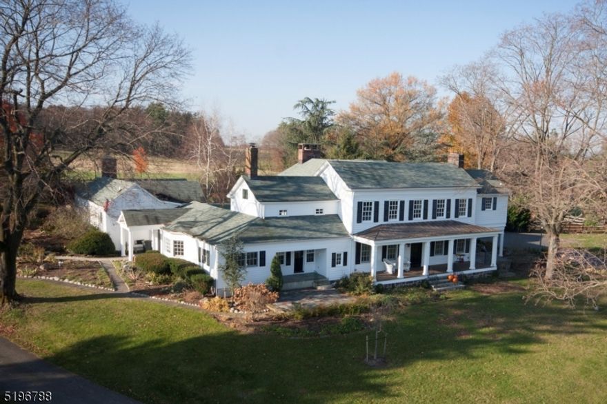 $54,000/yr REVENUE GENERATING property via rental and solar power income. A long driveway leads to this picturesque setting that includes spacious 4 bed, 4.5 bath Colonial offering a wide-open floor plan on 61.34 acres, a heated in-ground pool private oasis, 2 apartment guest house, bank barn with green house, tack rm, 5 stalls, plenty of space for equipment or country toys , 3 paddocks, 3 run-ins. First floor: cook's delight eat-in kitchen, bay window breakfast room, granite countertops, built-in Sub-Zero refrigerator, 5 burner gas cooktop with downdraft, Thermador dishwasher, Samsung convection wall oven, built-in microwave/convection oven, multi-generational or guest en-suite with entry, living room and large bedroom, living and family rooms, dining room, home office, billiard/rec room, powder room, sitting room with wet bar, hand painted backboard. Second floor: 2 additional en-suites. Main en-suite offers a 5-star resort bath, jetted tub, oversized arched tile & glass shower, commode room with bidet, 2 walk-in closets with custom cabinets. En-suite 3 offers full bath dressing room with built-in dresser and clothing racks, window seat, bedroom 4, laundry room, gorgeous main bath, linen closets. 5 fireplaces, 5 car garage, workshop, car ports, new garage and home roofs, turn key preserved farmland, 10-acre crave out allows for additional buildings and/or an additional residence, stocked fish pond, full property solar power, security system. Welcome home!