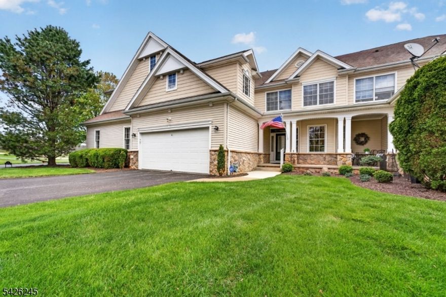Welcome Home to The Reserve at Hawk Pointe, an active 55+ adult community situated alongside the scenic Hawk Pointe Golf Course.This exceptional St. Andrews model Townhome offers refined living on a premium lot with breathtaking views of the 18th hole and tranquil pond. Meticulously maintained and beautifully updated home features 3 spacious bedrooms, 3.5 baths, thoughtfully designed for comfort and elegance. The first-floor primary suite, complete with cozy sitting area, custom walk-in closet and tastefully updated ensuite with freestanding soaking tub and shower. he remodeled gourmet eat-in kitchen with quartz countertops, custom split countertops with lighted showcase upper cabinets and cozy breakfast bar opens to the formal dining room highlighted by a full mirrored accent  wall adding sophistication for special gatherings open to the dramatic two story living  room showcased by the warm gas fireplace flanked by French doors that lead to the upper deck offering spectacular pond and golf course views. Upstairs you will find the private loft, two additional bedrooms, oversized utility closet/storage and a full bath. The  well-appointed remodeled full finished walkout  provides more livivng space and access lower covered patio lower level, presents a custom wet bar/recreation room/media room with a second stylish gas fireplace, home office and additional full bath & engineered wood floor. Enjoy access to the Clubhouse, outdoor heated pool, bocce courts and social activities.