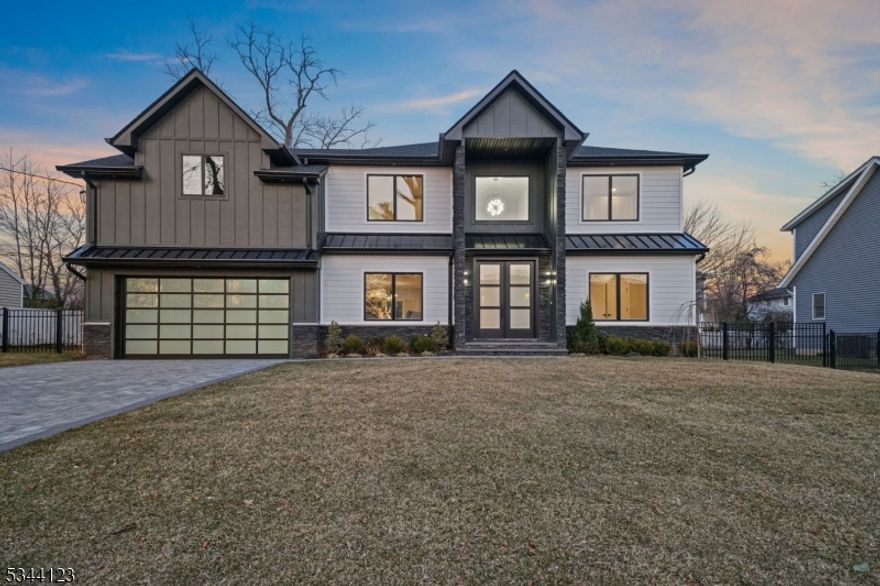 Experience luxury in this newly built 7-bedroom, 5-bathroom modern colonial. Grand double doors lead to an elegant entry foyer with a stunning chandelier. The open floor plan flows from the living room to the dining area, featuring backyard views, and into the family room with a floor-to-ceiling porcelain-wrapped gas fireplace. The gourmet Italian Pedini kitchen boasts high-end stainless steel appliances, sleek cabinetry, and a statement chandelier. The first floor also includes a bedroom and a stylish full bath with natural wood accents. Upstairs, the primary suite offers an ensuite spa bath, dual sinks, a soaking tub, and a stall shower. Two bedrooms share a Jack and Jill bath, while a junior suite features a private bath. The fully finished basement provides a nook, a rec room perfect for a home theater or gym, and two more bedrooms with a Jack and Jill bath. Welcome home! Owner holds a r.e license, Options to extend the primary bedroom and closets, inquire with our team.