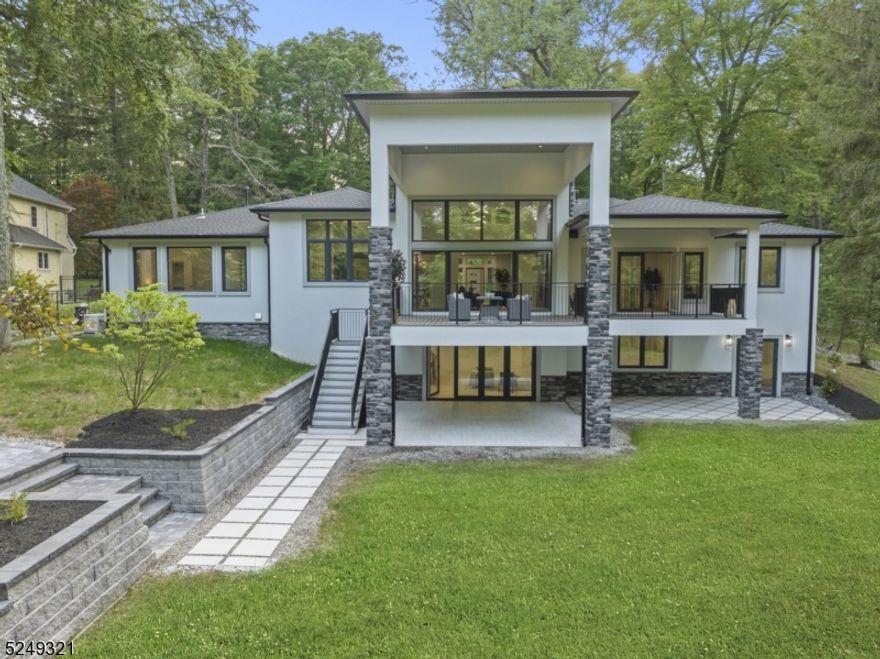 One of a kind brand new construction lakefront home in Pines Lake Community located less than 30 miles from NYC. This home features almost 6000 SqFt of finished living space located on 1.29 acres of land. The upper level features living room with a 17' ceiling, gas & wood burning fireplace and French doors leading to a deck; custom kitchen with 9' island & walk-in pantry, and oversized dining room. This level also features primary suite with private exit to deck, bathroom and 2 walk-in closets; 3 additional bedrooms, 2 full bathrooms, powder room, laundry room and mudroom. The lower level features a second independent living space with a custom full kitchen, oversized family room with gas fireplace and French doors leading to a patio, bedroom and full bathroom, making this home perfect for extended living or those that love to entertain. This level also features rooms for gym, theatre, laundry & office with a separate entrance. Enjoy Lake Life everyday!