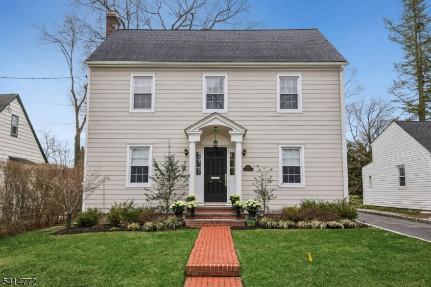 THIS IS THE HOUSE YOU HAVE BEEN WAITING FOR! From the moment you arrive, the beautiful curb appeal of this classic Colonial makes a lasting first impression. Inside, exceptional craftsmanship and attention to detail are evident throughout, with beautiful hardwood floors, thoughtful updates, and timeless design that blend modern conveniences with classic charm.The inviting first floor welcomes you with a gracious foyer and features a beautiful living room anchored by a fireplace and custom built-in shelving, an elegant dining room perfect for entertaining, and a gourmet kitchen with high-end finishes and custom cabinetry designed for both everyday living and entertaining. A charming sitting room provides additional living space, and a powder room completes the main level.The second floor offers three bedrooms and two full baths, highlighted by a spacious primary suite with walk-in closets and a luxurious spa-like primary bathroom.The finished third floor provides flexible living space ideal for a home office, playroom, guest suite, or potential fourth bedroom.The lower level offers high ceilings, a large recreation space, and a dedicated laundry area.Outside, enjoy a private yard with lovely gardens and a detached two-car garage. Ideally located close to town, parks, schools, and NYC transportation in Madison, voted the #1 place to live in New Jersey (NJ Monthly '19). DON'T MISS SEEING THIS BEAUTIFUL HOUSE IN A FANTASTIC MADISON NEIGHBORHOOD!