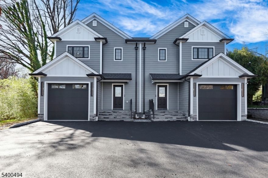 Brand new 3-bedroom, 2 full & 2 half bath (left side) townhouse/duplex style condo with built in garage and NO Maintenance fees! This quality-built home measures approx. 3,000 sq. ft. (plus an additional 750 sq. ft. finished basement) its only a 9 min walk to the train station where you can be in NYC in under an hour! 1st floor has 10' ceilings, Living room, dining room, combined with an open concept kitchen with custom cabinets, quartz tops with tiled backsplash, Thermador stainless steel appliances, which include stove, built-in microwave, dishwasher, and refrigerator. The family room has a wine cooler, an electric fireplace and sliders to patio overlooking the 250' deep fenced in yard. 2nd floor features 3 bedrooms, laundry closet with washer & dryer & 2 full baths. King sized Master bedroom with walk-in closets and private bathroom with soaking tub & shower stall. Finished basement with recreation room, half bath and utility room. Built in 1-car garage with a door opener & connection for future car charger, the driveway can accommodate a few cars. 2 gas forced air heating & air conditioning systems, gas hot water heater, security camera & monitoring system, hardwood floors. Lot size for the unit is 37.5 x 250 (.21 acres). Lawn sprinkler sprinkler will be completed weather permitting. Includes a 10-year new home warranty! No maintenance fee- requires each side to pay for dwelling insurance policy once a year. Steps away from YMCA, library & restaurants!