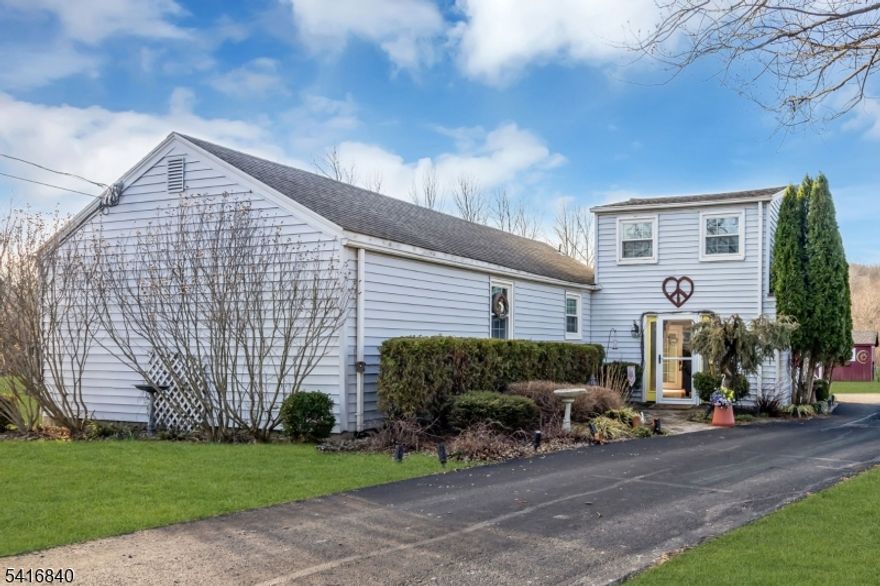 This cozy custom retreat is located in the heart of the desirable Stanton Historic District in Readington Twp, which includes the original Stanton General Store (now a well-regarded restaurant), Stanton PO & Stanton Learning Center Preschool. Set just off the road & adjoining hundreds of acres of open space & over 15 miles of hiking trails thru Round Mountain Nature Preserve. This One-and-A-Half Story home w 2-3 BR & 1 full BTH sits on over 1/3 acre & offers a balance between indoor comfort & outdoor activity. Two Story: comfortable living room with entrances through either the front door or the back patio & a master bedroom on the second floor with vaulted ceilings & views on 3 sides. Single Story: Updated eat-in kitchen with newer quartz countertops, DW, microwave & plenty of cabinet space; Updated full bath with walk-in double shower & custom double sink vanity with granite top; Full laundry room with newer washing machine & utility access; Second BR & a bonus room w/ large walk-in closet that can be used as a third BR. Outside you will find a large paver patio with built-in fire pit; a fenced-in garden area with raised beds & a large storage shed w electric. The roof was replaced in 2013 & the septic system was completely redesigned & upgraded to 3-BR capacity in 2008.  Walking distance to Stanton Village & a short drive to Whitehouse Station, Clinton, & Flemington. Well regarded Readington schools. Easy access to NJ Transit & I-78. Midway between NYC & Philadelphia.