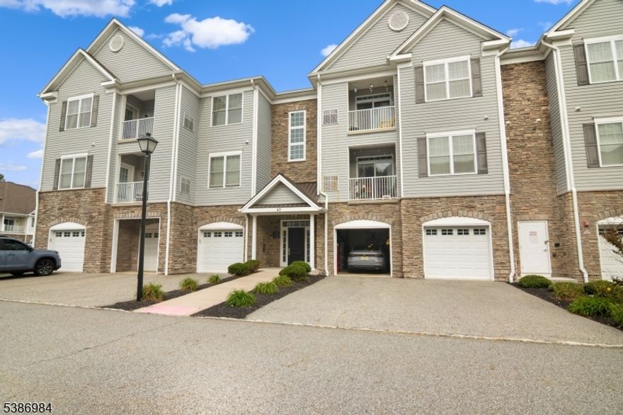 Welcome to Lakeland Village! This spacious 2-bedroom, 2-bath condo offers over 1,300 sq. ft. of contemporary comfort within a beautifully maintained community built in 2016. The open-concept design with high ceilings creates a bright, airy atmosphere, seamlessly connecting the living, dining, and kitchen areas perfect for both everyday living and entertaining. The modern kitchen features granite countertops, stainless steel appliances, and abundant cabinetry. Additional highlights include an in-unit washer and dryer, central air, a private outdoor space, a roomy garage with driveway parking, and a separate storage closet. Ideally located near shopping centers, dining, parks, and major highways, Lakeland Village offers the perfect balance of convenience and tranquility. Move-in ready and immaculate, this home is ready to welcome you just unpack and enjoy.