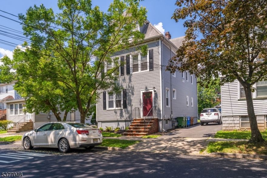 Once a legal 3-family home, this beautifully transformed property is now an expansive 2-family residence offering three full floors of thoughtfully renovated living space. Whether you're looking for an amazing rental income potential, or simply room to grow, this home has it all and it's located in prime location just blocks from downtown Linden and the train station. The first-floor features two bedrooms, living room, formal dining room, and a renovated full bathroom. The second floor mirrors this layout with two bedrooms, a living room, dining room, a second full bath, and an additional bonus room perfect for a home office, nursery, or guest space. The third floor offers one bedroom, an open living and dining area, and a bar setup ideal for entertaining. Plumbing connections are already in place beneath the bar cabinetry, making it easy to add a sink. The entire home has been freshly painted, including all units, the entrance foyer, and the back staircase. Every unit is equipped with new AC window units. The first-floor kitchen features new quartz countertops, a modern sink and faucet, and updated lighting. The second-floor kitchen includes quartz counters, brand-new cabinets, hardware, and a new microwave with built-in exhaust. Additional upgrades include newer water heaters (2021), new floors and carpets, vinyl double-pane tilt-in windows, maintenance-free insulated siding, and a fiberglass front entry door. Low Taxes!  A must see!