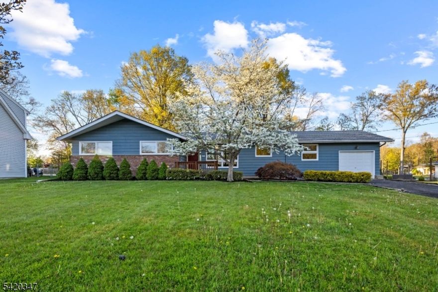 IMMACULATE AND SUN-DRENCHED! This lovingly maintained ranch is perfectly situated on an expansive, level lot. The main level welcomes you witha spacious living room featuring a cathedral ceiling, a wall of windows that fills the space with natural light, and a wood-burning fireplace. The formal diningroom is ideal for gatherings. A well-appointed kitchen flows into a cozy family room, and a versatile den/office perfect for today's flexiblelifestyle. The bedroom wing offers a private primary suite with a walk-in closet and a fully renovated bath, along with two generously sized bedrooms, anadditional updated full bath, and a convenient laundry closet. The oversized backyard provides the perfect setting for play, relaxation, and entertaining. DON'TMISS THE RARE OPPORTUNITY TO BECOME ONLY THE SECOND OWNER OF THIS LOVELY HOME!