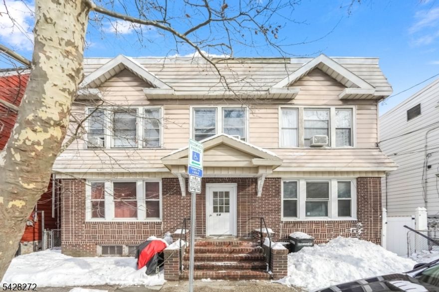 An exceptional investment opportunity this expansive and meticulously maintained 4-unit side-by-side duplex offers both timeless curb appeal and strong income potential. Showcasing a classic, symmetrical design, the property features a striking brick fa ade on the first level complemented by durable siding above, creating a clean and enduring exterior. Each of the four units is thoughtfully laid out across two stories, offering bright, airy interiors filled with natural light and highly functional floor plans that appeal to today's renters. With an established rent roll already in place, this property delivers immediate, reliable cash flow perfect for savvy investors or owner-occupants looking to live in one unit while generating income from the others. The inviting central entrance, highlighted by brick steps, adds to the property's welcoming presence, while sidewalk access ensures everyday convenience. Ideally situated on a residential block near public transportation, shopping, dining, and local amenities, this location supports consistent tenant demand. A rare chance to secure a solid, income-producing asset with long-term upside this is an opportunity you don't want to miss!