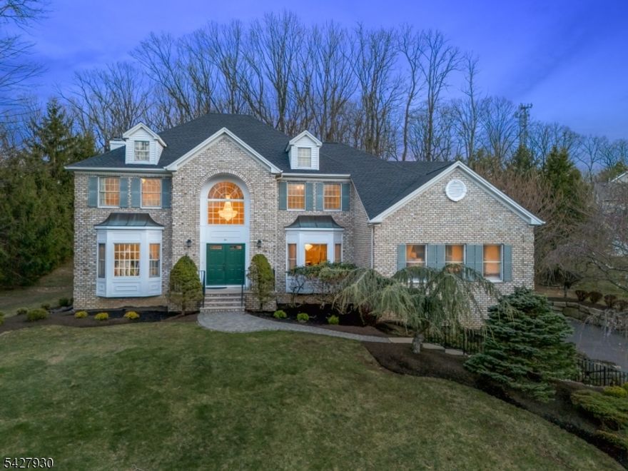 EXPANSIVE 5-BED/3-BATH COLONIAL WITH INCREDIBLE SPACE & PRIVACY! Welcome to elevated suburban living in a quiet Randolph neighborhood close to shops, schools, hwys & bus/train to NYC. Set upon a rise on a lovely cul-de-sac street, this 1990s brick-front colonial was designed with space, comfort & modern living in mind. Exterior exemplifies resort-style living with stately curb appeal & a zen-like backyard featuring waterfall, koi pond & gazebo surrounded by tall trees & greenery. Inside, you're greeted by soaring ceilings in the double-height open foyer with impressive crystal chandelier glistening in front of a Palladian window. Hardwood floors flow throughout 1st Level which offers infinite possibilities in crafting the spacious rooms to fit your lifestyle. Living & Dining Rooms have large bay windows with front yard views. Family Room with stone wood-burning fireplace opens into Eat-in Kitchen w/ newer SS appliances, center island & dining area in front of 2 sets of sliding doors to back patio, perfect for indoor/outdoor living. The Great Room is literally great in size use it for a game room, studio, play room, whatever you wish! A corner bedroom, Full Bath & Laundry complete this level. Upstairs boasts sprawling Primary Suite with attached office/dressing room & two large walk-in closets! 3 more Bedrooms & a Full Bath make rest & relaxation easy. Unfinished Attic & Lower Level space with high ceilings add to the potential. Icing on the cake is the attached 3-car garage!