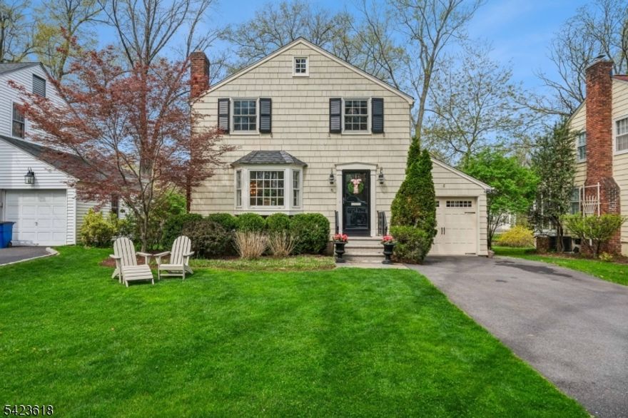 Tucked away on a cozy cul-de-sac in one of Chatham Borough's most sought-after neighborhoods, this cherished home blends classic charm with thoughtful, designer updates throughout. Natural light fills every room, highlighting beautiful hardwood floors and a seamless flow perfect for both relaxed living and entertaining.The stunning kitchen features white marble countertops, white cabinetry, and high-end stainless steel appliances. Morning light graces the elegant living room with its beautiful fireplace, while glowing sunsets fill the family room with custom built-ins. Three bedrooms, 1.5 baths, and a finished basement round out the interior. Step outside to a screened porch, back patio, and a tranquil backyard retreat with mature plantings, ideal for serene evenings. Just steps to top-rated Chatham schools, the train, and town. This one checks every box.