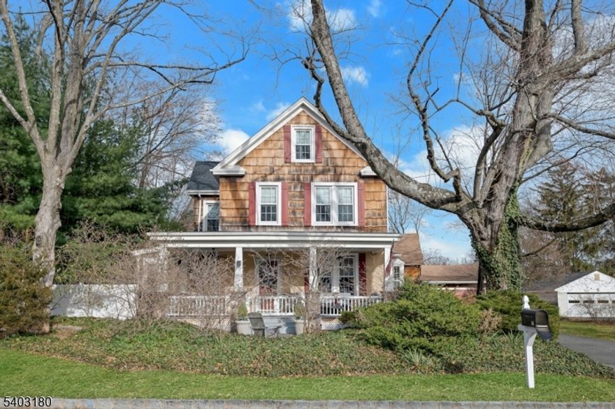 This immaculate 4 bedroom colonial has all the charm of a traditional farmhouse combined with modern updates.  The formal living room and dining room feature hardwood floors with inlay.  The Living Room is separated from the formal dining room by pocket doors.  The dining room offers a built in cabinet and charming window seat. The sunken family room has a wood burning stove and built-ins as its focal point.  The kitchen has a separate breakfast nook and granite counters.  The master bedroom features a full bath, walk in closets and a separate sitting area.  Addl features include high ceilings, custom trim, updated multi zone heat and central A/C, new roof and more!  The detached barn has spaces for 3 cars as well as a workshop and/or storage.  All this and more is situated on almost a half acre of park like property that is completely fenced in.  It is close to major highways, shopping and public transportation.  Nothing to do but move in!