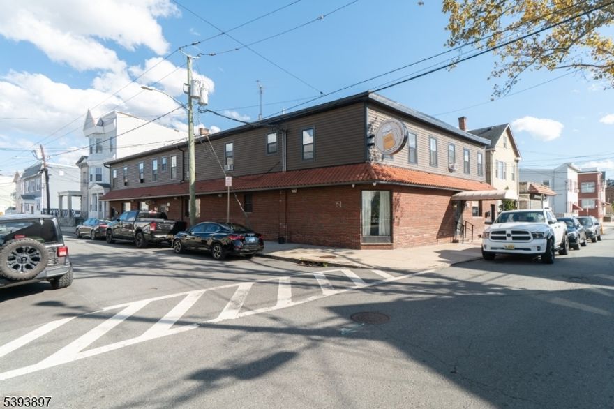 Exceptional Investment Opportunity " Fully Renovated Mixed-Use Building with Liquor License in North Ironbound!Turnkey mixed-use property ideally situated near Six Corners in Newark's vibrant Ironbound district. The building features a fully equipped restaurant and bar with valuable liquor license, plus three updated residential apartments above. Two units are 3BR/1BA and one is 2BR/1BA " all rented month-to-month and below market value, offering immediate upside potential.The restaurant and bar were completely renovated within the past year, showcasing new flooring, bar setup, furniture, hood system, three AC units, sound system, TVs, security cameras, and designer ceilings. Liquor license, operating licenses, and inventory (valued around $650,000) are included in the sale, adding significant business value.The restaurant space is vacant " perfect for an owner-operator or investor seeking strong income potential (market rent approx. $12,000/month NNN). Additional highlights include parking for 30 cars under a long-term lease and reasonable property taxes for the area.A rare chance to acquire a fully renovated, income-producing property with liquor license in one of Newark's most desirable and high-traffic commercial corridors.