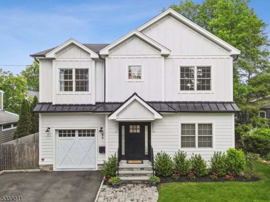 Nestled on one of Chatham Boro's most coveted streets, just blocks from NYC trains, top-rated schools, restaurants and thriving downtown, this stunning 3 year old modern farmhouse offers the perfect blend of timeless elegance and everyday comfort. From the moment you step inside, the impeccable craftsmanship and thoughtful design takes your breath away, soaring ceilings, rich hardwood floors, intricate moldings, and sun-drenched spaces invite you to feel instantly at home. The heart of the home is the show stopping white chef's kitchen, outfitted with top of the line appliances, a center island with breakfast bar, and a seamless flow into the dining room and spacious family room with a cozy gas fireplace perfect for gatherings or quiet evenings in. A versatile first floor office or den, a mudroom, and stylish powder room complete this main level. Upstairs, all four bedrooms are ensuite, offering privacy and comfort for all. The serene primary suite is a true retreat with a spa like bath featuring a soaking tub, oversized shower, and walk in closet. The beautifully finished lower level extends your living space with a fifth bedroom, full bath, office, and large recreation room. Step outside to a beautifully landscaped, fenced-in yard with a patio ideal for entertaining or relaxing in total privacy. This is more than just a home it's a lifestyle, where every detail has been curated for luxury, warmth, and convenience in one of Chatham's most desirable locations.