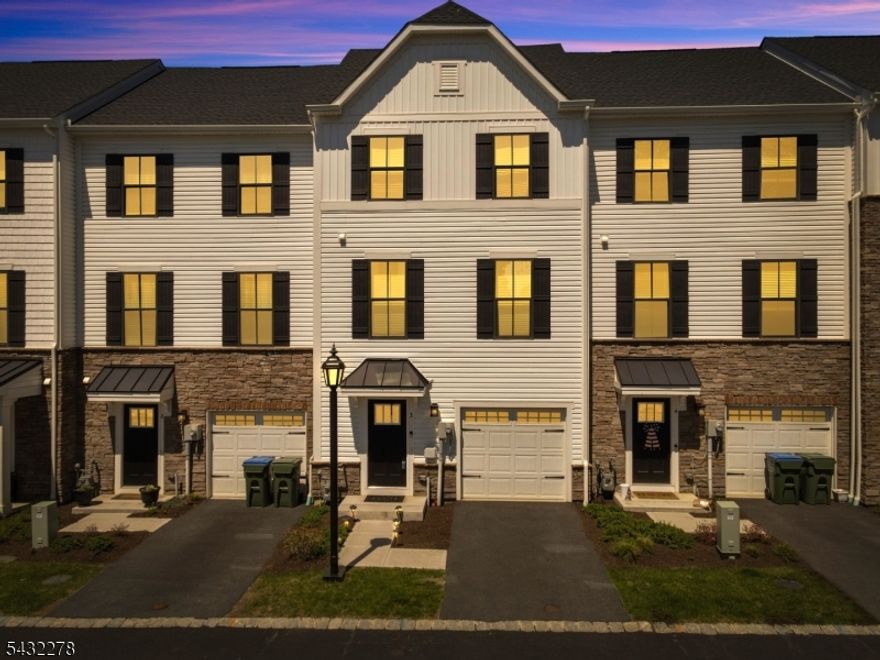 Enjoy modern living and everyday convenience in this newer construction interior-unit townhome built in 2024. Offering nearly 2,000 sq ft across three beautifully finished levels, this 3-bedroom, 2 full bath, 1 half bath home is thoughtfully designed for today's lifestyle. The entry level features a versatile flex space ideal for a home office, gym, media room, or playroom, along with direct access to a private patio perfect for relaxing or entertaining outdoors. Upstairs, the sun-filled main level showcases an open-concept layout with seamless flow between the living and dining areas. The designer kitchen features quartz countertops, stainless steel appliances, and a large center island with breakfast bar seating. Step outside to your private deck for easy indoor-outdoor living, while a convenient powder room completes this level. The top floor offers three spacious bedrooms, including a serene primary suite with tray ceiling, walk-in closet, and spa-inspired en-suite bath. Two additional bedrooms, a full hall bath, linen storage, and in-unit laundry provide both comfort and functionality.Ideally located near dining, shopping, outdoor recreation, the Hackettstown Train Station, and Routes 46 & 80 for an easy commute. Enjoy all that Hackettstown has to offer with its charming, walkable downtown filled with local restaurants, cafes, shops, and community events.