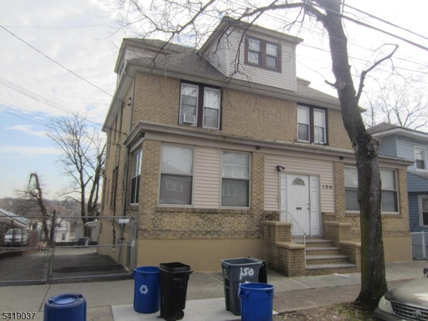 Excellent property features separate heat, finished basement w/full bath, well maintained apartments, 3rd floor updated w/new refrigerator & stove, newer roof, all brick, large 3-car garage, great investment property.