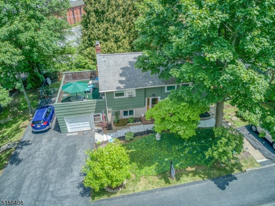 Beautiful custom built bi-level Denville home located on an extra large corner lot. Walking distance to train station, shopping areas, Indian Lake & DWTN Denville. Ideal home for versatile living, virtual home offices & separate entry in-law suite. Lots of space! Lower level has laundry room (washer & dryer included) workbench area, dining room w/ceramic tile floor & coat closet, kitchen w/breakfast bar & SS appliances, 22x13 foot living/great room w/WB fireplace features two sets of sliders that open to a covered deck. Lower level also offers a full bathroom and two additional rooms, one with sliders that open to the backyard. These rooms can be used as bdrms, sitting/play rooms or home offices. Upper level has HW floors. Primary bdrm w/private entrance, full bath w/jacuzzi tub & walk in closet. 3 additional bdrms & a 3rd full bath w/located on the upper level w/lots of closet space & a roof deck off 2 of the bdrms.  This home also offers a 10x10ft shed next to the back deck and a 20x12 ft storage shed w/loft located on the lower yard. 3 driveways & well groomed landscaping. Brand new front walk and outdoor staircase that leads to the primary bdrm suite. Ceiling fans & window AC throughout home. Enjoy lots of land, space, natural light, great neighbors and an outstanding school system. Easy access to route 80, 10, 46 and 287. Fenced in backyard with lots of privacy. 3 year old furnace. Relaxing environment..... But close to everything! Great value for the price.