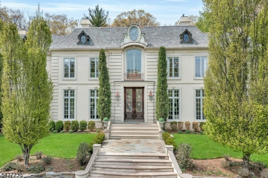 Why Travel to France when timeless French elegance can be yours every day?   Welcome to an over 6000 sq ft masterpiece that brings the romance, refinement and artistry of French design to your doorstep.  From the moment you arrive, this home evokes the charm of a countryside chateau blended seamlessly w modern luxury living.  Architectural details include arched doorways, intricate millwork, and sun-drenched interiors from floor to ceiling windows create an atmosphere of sophistication.  Every room tells a story: from the grand yet intimate living spaces to serene bedrooms that  feel like a retreat.  Tucked away on a cul de sac, built by a renowned local builder, This home is a lifestyle Where everyday feels like a getaway and the essence of France is your reality..