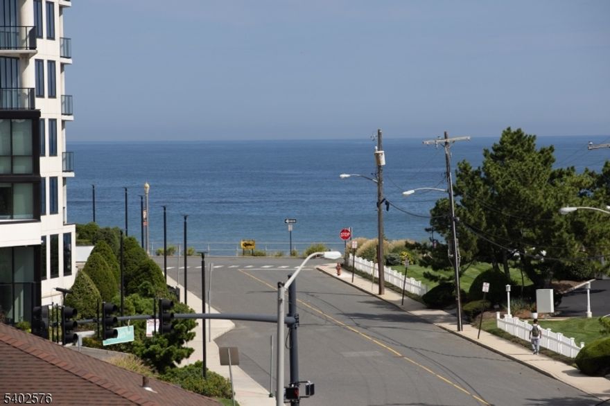 New Construction! Experience Unparalleled Luxury Living at The Seashore in Long Branch! Ride your private in-unit elevator up 4 levels to your expansive rooftop terrace & savor sweeping ocean views. Just minutes from the beach & Pier Village, this limited collection of 14 luxury townhomes offers close to 3,000 sqft of designer living space with 3 bedrooms + den, 3.5 baths, multiple balconies & a heated, EV charger ready garage. A modern masterpiece, each home features custom European windows and doors, open-concept living, and a chef's kitchen with premium smart appliances: Nostalgie by ILVE stove & SAVALO refrigerator and dishwasher.After a day at the beach, relax in the exclusive heated resort-style pool or explore the vibrant dining, shopping, and nightlife of Pier Village, Red Bank, Asbury Park, and Sea Bright, with NYC just a ferry ride away. Located minutes from the future home of Netflix, this is coastal luxury at its finest!