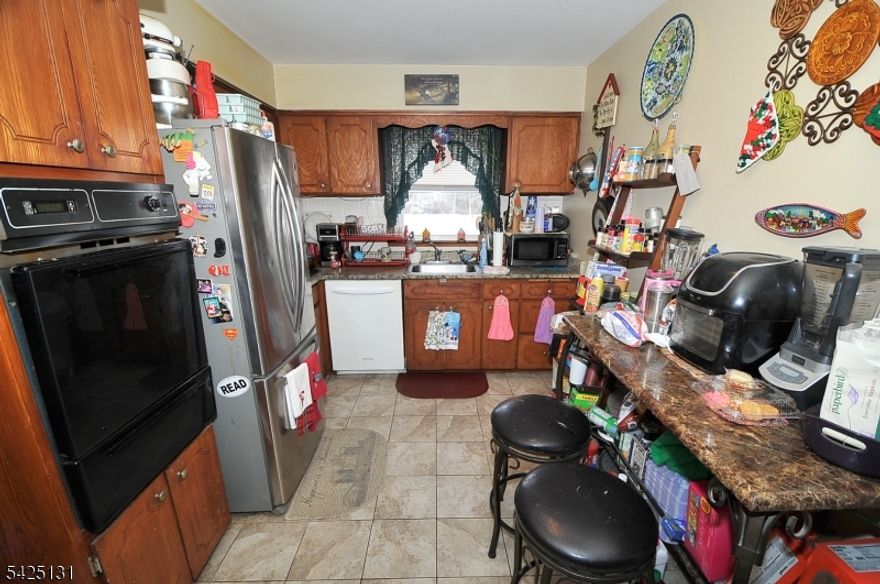 Spacious multi-family home located on quiet one way street with 2 large apartments. Each unit features 3 bedrooms, eat-in kitchen, living room and dining room. First floor unit has additional ground level space with 2 finished rooms, summer kitchen, and full bathroom allowing for bonus space or in-law suite option. 2 car garage. 2nd floor with 1.5 bathrooms. Newer roof (2021) and two water heaters (2019). Located next to the Wheeler Park, ideal for relaxing, exercising or enjoying time with pets. Just minutes from downtown Linden, restaurants, shops, and Linden Plaza. Commuters will appreciate close proximity to NJ Transit Station with direct line to NYC, plus easy access to major highways and Newark Airport. All tenants are month to month. Must-see!