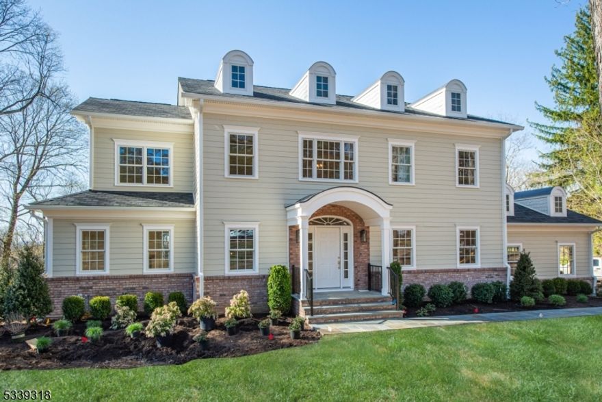 NEWLY CONSTRUCTED AND JUST STAGED! Brand new stunning 6,400 sqft colonial in one of Essex County's most desirable communities. This 5 bedroom smart home features an open-concept design, soaring 9-foot ceilings, & exquisite finishes throughout. The 1st floor showcases a grand two-story foyer, spacious great room w/ gas fireplace, gourmet eat-in kitchen w/ professional-grade Wolf 8-burner double oven, Sub-Zero refrigerator, custom pantry, stylish bar/butler's pantry w/ wine & beverage refrigerators plus ice machine, custom laundry room, powder room, & a full bathroom w/ possibility of adding a first-floor suite or au pair quarters if desired. Upstairs, the master bedroom features a spa-like master bath w/ soaking tub, walk-in shower, double sinks, & radiant heated floors, three additional bedrooms- one with an en suite bath & two w/ Jack-and-Jill bath, as well as hookup for a second washer & dryer. Fully finished walk-out basement opens to an expansive backyard w/ beautifully crafted stone walkways and patio plus ample space for a pool. Other notable features include 11 HVAC zones, 300-amp electrical service generator-ready, custom closets, crown moldings, bidet-style toilets on 2nd floor, large attic w/ plenty of storage, landscape package, built-in sound system speakers, alarm ready, Ring cameras, & fully integrated smart home tech. by SammSound for controlling thermostats, lighting & irrigation system. C/O issued & ready for immed occupancy & includes 2-10 New Home Warranty.