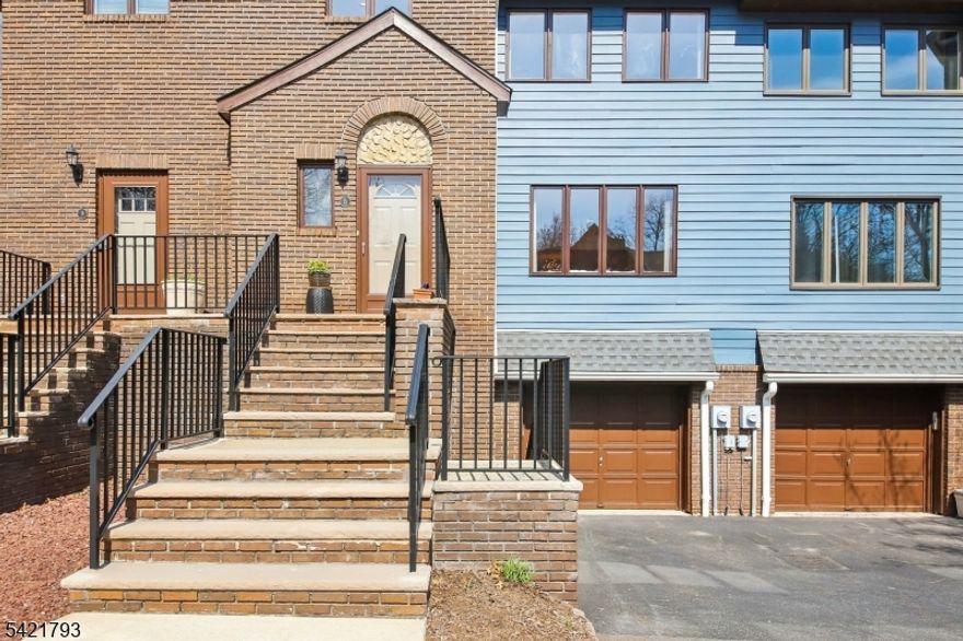 Welcome to 8 Village Green Ct, a hidden gem set on a private cul-de-sac within 4.5 acres of lush, flat, manicured grounds with a private pool, just 2 blocks to vibrant downtown South Orange & NYC direct trains. Freshly painted, sun-drenched approx. 2,261 SF townhome featuring 3BR, 2 full & 2 half baths offers exceptional space, comfort & flexibility delivering the feel of a single-family home w/low-maintenance living. This home is all about lifestyle and convenience enjoy a 2nd floor laundry room & efficient 2-zone AC/heat. Pets welcome. Expansive open-concept main level showcases a large LR with a wall of windows flowing seamlessly into a formal DR, filled w/abundant natural light. The eat in kitchen offers generous cabinet, pantry closet & counter space w/excellent potential. Sliders open to an oversized private deck (250 SF), ideal for outdoor dining, summer entertaining, grilling, or relaxing while overlooking serene, park-like grounds. Includes a powder room. Upstairs features a spacious primary suite w/2 WICs & en-suite bath w/double vanity, soaking tub & separate shower, plus a 2nd large BR & full bath. Finished LL w/soaring 10' ceilings & cozy wood-burning fireplace provides versatile space for 3rd BR, office, gym or playroom, with a convenient powder room & direct access to oversized garage. Don't miss it! Exterior updates paint 2024 roof 2021 sidewalks 2019.