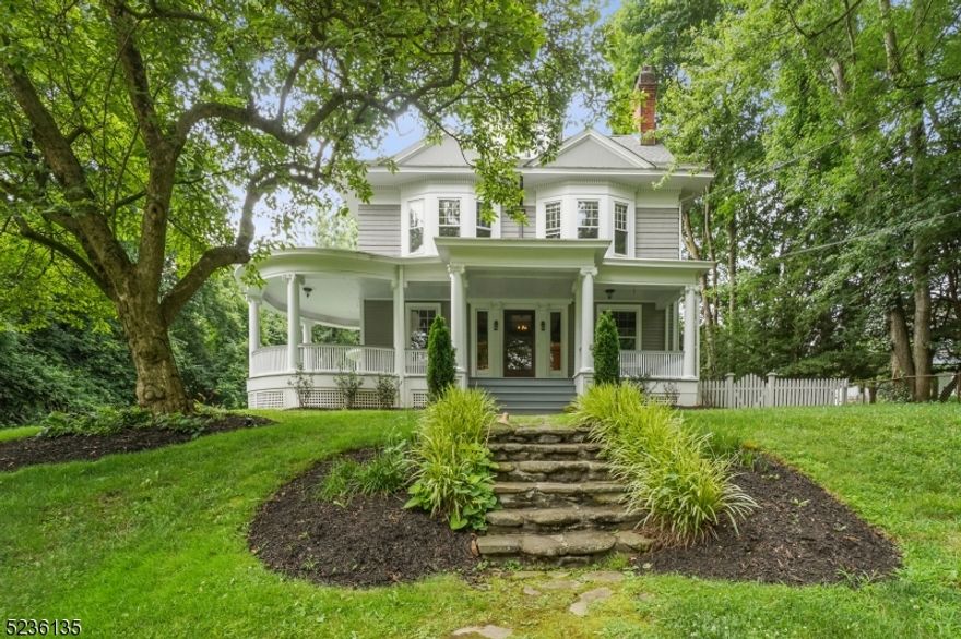 Own a piece of history with this 1890 home, lovingly preserved to provide a blend of historic & modern amenities within the coveted Gardens neighborhood. This home sits majestically on a private lot nestled at the end of a long driveway that ends at a detached 3-car garage. A porch that evokes nostalgic charm wraps around the front. Enter the home and you'll find original hardwood floors, intricate wood accents, and architectural details that add nostalgic character throughout. Skilled artisans meticulously restored the woodwork by hand, using traditional techniques to preserve its original beauty. The main level features a living room graced with wood beams and fireplace as its focal point. A dining room adorned with golden accents provides a setting for gatherings. A radiant parlor, bathed in natural light and equipped with built-in shelving, is designed for crowds. An eat-in kitchen complete with breakfast nook and pantry, offers a sunlit space for cooking with included appliances. Tucked away, an office provides another space to bask in privacy. A half-bathroom completes this floor. Go to 2nd level through one of 2 staircases for a primary suite with a full bathroom and fireplace. A long hallway joins two additional bedrooms & a full bathroom. The 3rd floor has 3 additional bedrooms & a full bathroom. A partially finished basement, ready for your creative vision to make your own, adds valuable space to the home and includes a convenient laundry area and half bathroom.