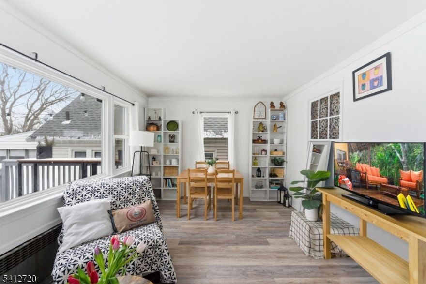 Set on a quiet block in Union's desirable Putnam section, this spacious 4-bedroom, 2-bath home offers flexible living across four finished levels and an unbeatable location. Situated between two golf courses and just minutes from town, it blends neighborhood charm with everyday convenience.The main level features an entry foyer, a large living room, and an open kitchen with refinished cabinets and direct access to a private, gated driveway. A bright rear addition provides the perfect dining area or flexible bonus space for entertaining, working, or relaxing.The second level offers three bedrooms and a full bath, while the finished attic serves as a true fourth bedroom ideal for guests, a private retreat, or a home office. The finished basement includes a full bath, laundry, and additional living space suitable for recreation, fitness, or extended living needs.Recent improvements include a newer roof with financed solar panels (approximately $200/month with low utility costs), 13 triple-pane windows installed in 2024, a new hot water heater, updated storm doors, and fresh interior and exterior paint. The detached garage is fully sheetrocked and powered, perfect for storage, a workshop, or creative use.Located just three blocks from the NJ Transit train, one block to Morris Avenue shops and dining, and close to schools, parks, major highways, and Newark Airport, this move-in-ready home offers comfort, efficiency, and commuter convenience.