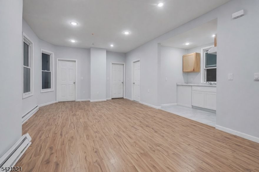 Investor alert " huge income-producing 3-family located on the Eastside of Paterson featuring high ceilings throughout. Unit 1 offers 3 bedrooms, living room, kitchen, and full bath (vacant). Unit 2 features 4 bedrooms, living room, kitchen, and full bath (vacant). Unit 3 includes 4 bedrooms, living room, kitchen, and full bath (currently month-to-month). The property also offers a partially finished basement with a full bathroom and 3 bonus rooms. Utilities are fully separate with 3 boilers and 4 meters. Conveniently located near NJ Transit trains and direct NYC bus routes with easy access to major highways including I-80, Route 19, and Garden State Parkway ideal for commuters. Whether you're a first-time buyer looking to live in one unit while generating income from the others, or an investor seeking strong cash flow, this is a great opportunity. Sold as-is.