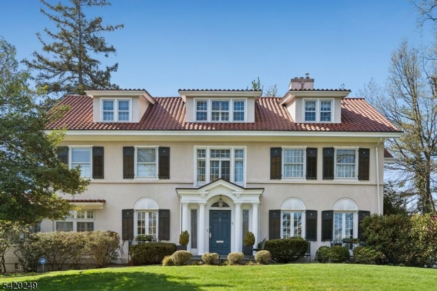 Picture a home that perfectly captures the charm & sophistication of Maplewood-a town known for its tree-lined streets, classic architecture, & strong sense of community. This exquisite 6BR, 3.1 BTH home rests on a quiet street on gentle knoll in the coveted Roosevelt Estate section, & is like no other. Step through the front door into a welcoming sun-filled foyer where classic details meet modern living. Striking millwork, high ceilings, hardwood floors, & leaded windows all create an elegant yet comfortable atmosphere. The main floor offers a gorgeous DR w/FP, leaded windows & unmatched millwork, a game room, sun-filled FR w/ generous windows, spacious LR w/FP, & an updated chef's kitchen w/center island, eating area & butler's pantry as well as access to the deck, oversized patio & private yard. As you ascend to the 2nd floor, a tranquil sun room awaits your enjoyment. The primary suite boasts a stunning marble BTH w/double vanity, soaking tub & an over-sized shower plus a huge WIC & office w/built-in bookcases (could be a BR) plus 2 more well sized BRS & BTH. The 3rd fl offers 3 more generous BRS & BTH, charming Harry Potter room & attic storage. A large full bsmnt w/generous storage, laundry area & endless opportunity to finish, if desired. From the unmatched curb appeal, private setting, exquisite details, tasteful upgrades & perfect location so close to the quaint Maplewood Village, NYC train, restaurants, parks & shop this home is truly special.