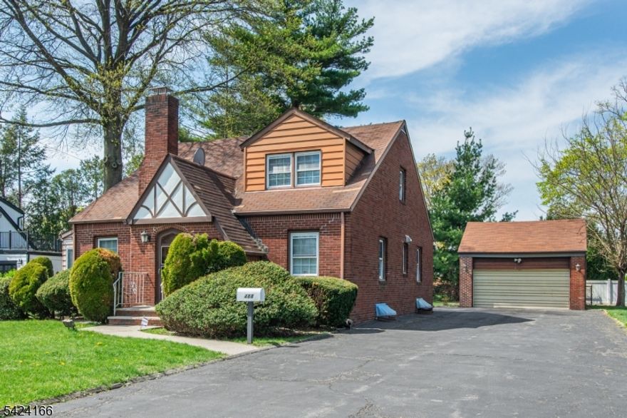 Welcome to this large custom brick home offering spacious rooms and comfortable living throughout. Situated on a sizable lot on a street once known as "Millionaire Way,  this home is surrounded by other prestigious properties, adding to its charm and appeal. Inside, you'll find 3 to 4 generously sized bedrooms, including an oversized second-floor bedroom that can easily be divided into two separate rooms. The home features a formal dining room perfect for entertaining and a spacious living room with a cozy fireplace ideal for relaxing evenings. The full eat-in kitchen offers convenient access to the rear of the home, making it easy to bring in groceries from the driveway and two-car garage. The large, freshly painted basement offers endless possibilities finish it for additional living space or use it for abundant storage. Additional highlights include a two-car garage with high ceilings and automatic opener and security system for peace of mind.1 year Assurant home warranty premium plan included. Located just steps to NYC transportation, major highways, shopping, and all three school levels, this home truly combines comfort, convenience, and potential. A Must See!