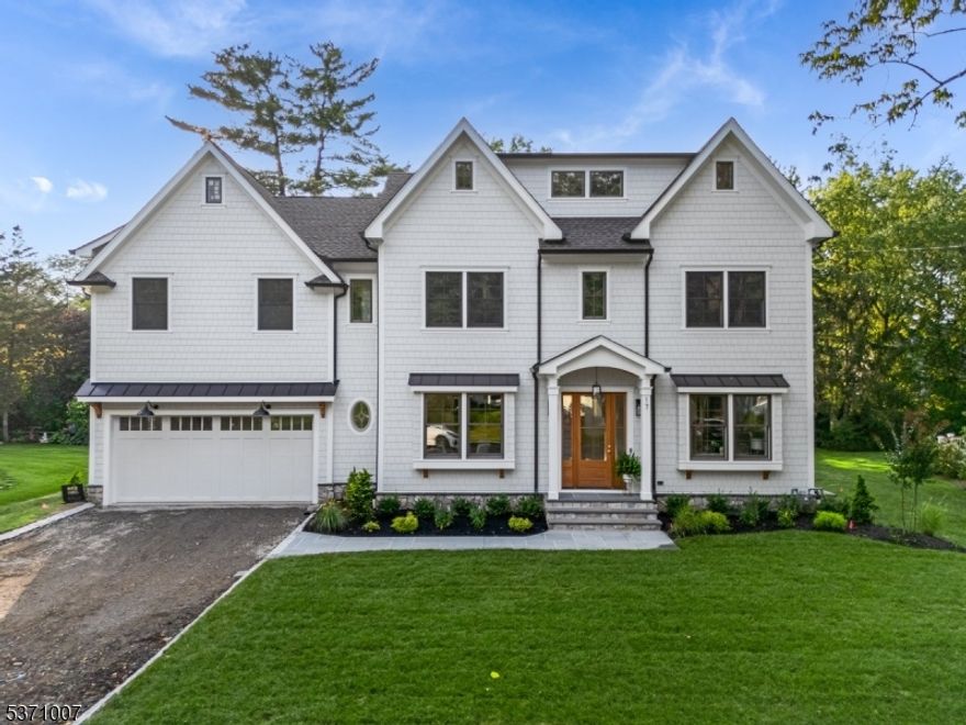 STUNNING luxury brand new construction in the heart of Chatham, where timeless elegance meets modern sophistication. This 5 bdrm 5 bath center hall colonial offers all high-end finishes, expansive living spaces, and seamless indoor/outdoor flow. A welcoming foyer leads to an open-concept living area featuring 10' ceilings, custom millwork, and oversized windows that bathe the home in loads of natural light. The gourmet chef's kitchen is a masterpiece, equipped with top-of-the-line stainless appliances, custom cabinetry and a spacious island. The adjoining family room complete with custom built-ins flanking the gas fireplace with stone surround provides the perfect space for relaxation and entertaining. A living room/home office, formal dining room, walk in pantry, mudroom with custom built-ins and a chic powder room complete the main level. Retreat to the luxurious primary suite on the second floor, a private sanctuary with a spa-inspired en-suite bath, a soaking tub, oversized shower, double vanity and 2 walk-in custom closets. Each additional bdrm is generously sized, featuring en-suite baths & custom closets. The attic is finished for addtl space to spread out or use as 2 home offices. The finished lower level offers endless possibilities with a spacious recreation room, a fitness area/media room and addtl bdrm w/en-suite bath. A beautifully landscaped backyard with spacious bluestone patio creates the ultimate setting for year-round enjoyment (whole house generator)