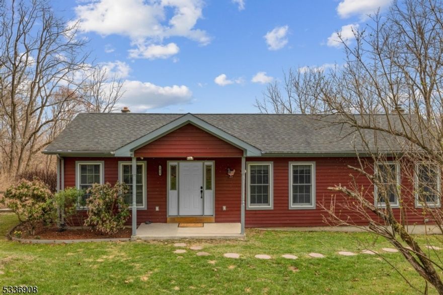 This charming ranch-style home features 2x6 framing for enhanced insulation and durability. The exterior is clad in Hardy Plank siding, offering both aesthetic appeal and resilience. Anderson 600 series windows provide energy efficiency and ample natural light. Inside, the home boasts three bedrooms and two bathrooms, including a luxurious primary bathroom with a jetted tub and stall shower. The walkout basement features a wood-burning stove and high ceilings, adding to the spacious feel. A large foyer welcomes you, leading to an eat-in kitchen equipped with oak cabinets, a stainless steel farm sink, granite countertops, and recessed lighting. Wood floors flow throughout the main living areas. Laundry includes a washer and dryer. Additional features include attic pull-down stairs for extra storage, a fenced yard, a deck, a chicken coop, and a duck coop. Enjoy seasonal views of the lake. The home is also equipped with a plug-in generator for added convenience and security. This property combines modern amenities with rustic charm, making it a perfect retreat.