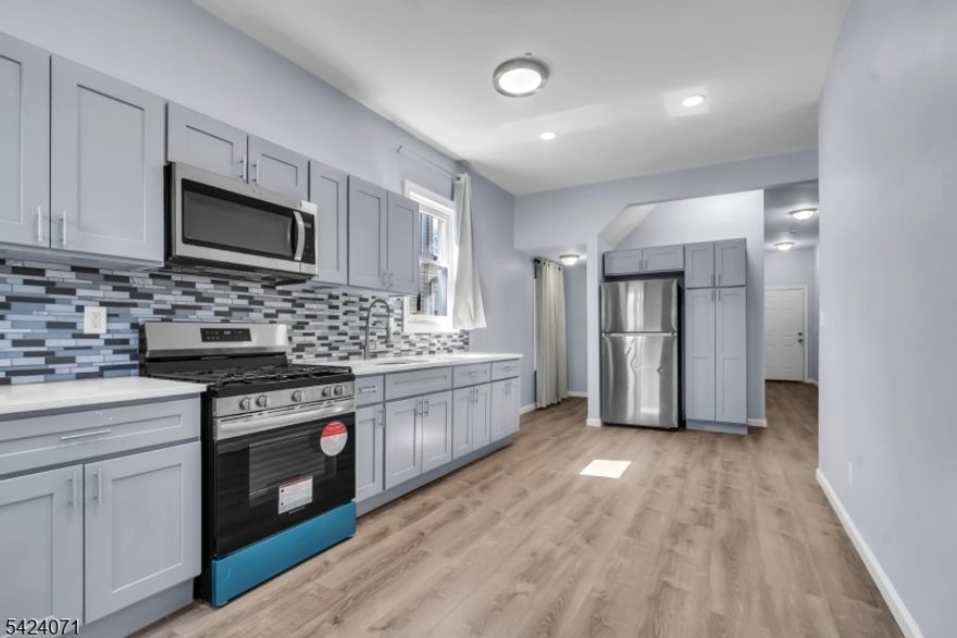 Renovated two-family home in a prime East Orange location, offering approximately 2,133 sq ft of living space on a 4,831 sq ft lot. Configured as a 4BR/3BTH duplex over a 2BR/1BTH unit, the property provides flexibility for both owner-occupants and investors. The duplex unit is currently occupied on a month-to-month lease, offering immediate income with future optionality. Additional features include an unfinished basement with potential for expansion and a location near EWR Airport and the Vailsburg section of Newark, providing strong accessibility and consistent demand. Turnkey condition with long-term upside.This home qualifies for the Community Advantage Loan Program - 5% Down Payment, No PMI, Low Interest Rate, $5k toward Closing Costs or Down Payment.