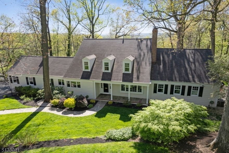 PRIVATE SUNSET RETREAT! Nestled on a ridge at the end of a private lane, this expansive home provides a special retreat from suburban hustle and bustle. All central living spaces of the home - Kitchen, Dining Room, Living Room, Primary Bedroom and three bedrooms on the 2nd floor plus the Rear Deck - have walls of windows facing west, enjoying spectacular treetop vistas throughout the year. The house, RENOVATED OVER THE PAST TEN YEARS, provides multiple living and entertaining spaces, indoors and out. Grill and enjoy dinner on the back deck. Access the lower level yard and garden. Sit around the warmth of a firepit, star gazing on a clear evening. Relax amongst the leaves changing color in the fall or watch peaceful snow falling in the wintertime. Work or study at home in the special spaces on the 1st, 2nd and lower level floors. 6th en Suite Bedroom on Lower Level with its own entrance is perfect for overnight guests. Whole-House Generator. Finished square footage calculated but not guaranteed - to be confirmed by buyer.