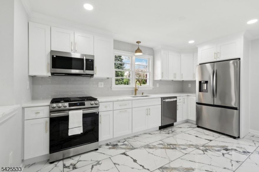 Welcome to 8 Oak St! This stunning, recently renovated home is a modern gem that beautifully combines comfort and practicality. With an inviting open-concept layout designed for both entertaining and everyday living, this property is filled with an abundance of natural light, creating a warm and welcoming atmosphere. This home features three bedrooms along with TWO additional BONUS rooms that can be utilized as an office, playroom, hobby room, fitness area, game room, or for storage it's entirely up to you! The finished basement adds even more value, and you'll also enjoy a BONUS TV included with this property. Benefit from the convenience of public water and public sewer, and take advantage of the charming backyard that provides an ideal space for outdoor relaxation or play, making it perfect for creating lasting memories. Nestled in a welcoming community, you'll have easy access to local amenities, parks, and public transportation. Additionally, this home is just a short distance from US Route 46, I-80, NJ Route 183, Route 206, the train station, and shopping centers. Don't miss the opportunity to own this beautiful, move-in-ready home that has it all schedule your showing today!