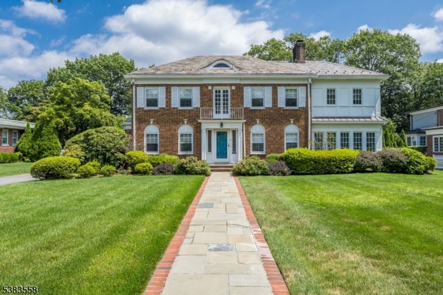 Classic elegance updated for modern living with tremendous curb appeal, grand-scale rooms, and resort-style outdoor space. Stunning craftsmanship includes inset hardwood floors, paneled moldings, & original details throughout. Expansive entry Foyer opens to sun-filled Dining and Living Rooms with original wood-burning fireplace. Chef's Kitchen boasts high-end stainless appliances, white cabinetry, granite counters, and a large Center Island, flowing into the Family Room with walls of windows overlooking the pristine property. Heated Sunroom leads to the fully fenced, amenity-rich backyard: heated Pool, Outdoor Kitchen, Hot tub, basketball court, composite covered Deck with TV, fire pit, and built-in heaters makes for impeccable multi-season entertaining. Upstairs, the gracious Primary Suite offers a Juliet balcony, custom Walk-in Closet, and spa Bath with heated floors, soaking tub, and oversized shower. Two Bedrooms feature a Jack & Jill bath; a fourth enjoys a convenient En-Suite. Third level hosts a Bedroom, full Bath, and Cedar Closet. Lower level features a 750-bottle wine room, gym, Office area, Rec room (which could also be a 6th Bedroom), easy backyard access, along with a second laundry and Powder Room. All under 1 mile to 3 NYC/Hoboken-direct train stations and minutes to downtown Montclair &  top Glen Ridge schools. A regal beauty at 411 Ridgewood Ave!