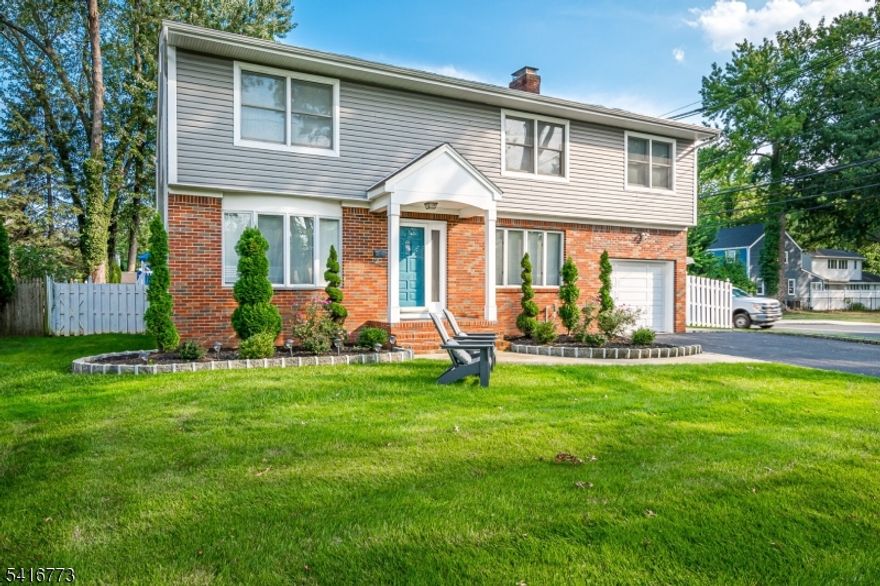 Immaculate 4-bedroom, 3-bathroom renovated Colonial home. Upon entering, the spacious living room with a beautiful bow window flows seamlessly into the formal dining room. The eat-in kitchen features granite countertops, stainless steel appliances, a pantry, and a separate breakfast area. The first floor is completed by a cozy family room with a brick hearth fireplace and a full bathroom. The second floor boasts a primary suite with walk-in closets and a private bath. Three additional generously sized bedrooms, a full hall bathroom, and a laundry area complete the upper level. A spacious basement offers excellent potential for finishing or can be used for additional storage.Enjoy the manicured, private fenced backyard with a patio perfect for relaxing or entertaining. Conveniently located near schools, Tamaques Park, and downtown Westfield for shopping, dining, and easy NYC transportation.