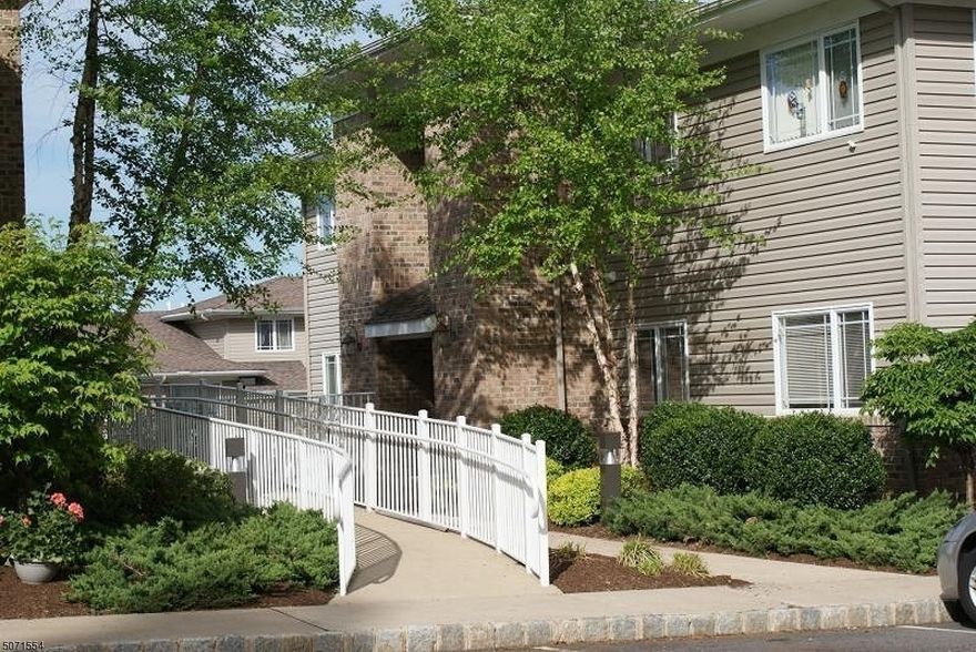 Opportunity Knocks! NO STEPS TO CLIMB! A 55 Plus Community! Wonderful 1st floor condo with a detached Garage and an assigned parking. Parking  space #50, Garage # 14.Freshly Painted inside and Brand-new Luxury Vinyl Flooring for easy cleaning. An Eat in Kitchen with a Gas Range, Refrigerator, Microwave and Dishwasher. There is a Stackable Washer & Dryer inside the Condo for your Convenience. A Living Room/ Dining Room. The Primary bedroom offers a Primary Bathroom with a Stall Shower and 2 Closets. A Guest Bedroom with a Closet and Another Full Bathroom with a Tub/Shower. Enjoy the Community room and a Park Area to Gather with Friends. Guest Parking is also available. Close to Shopping, Restaurants, Golf, Public Transportation and Major Highways. Make this your 1st and only stop! You will be glad you did!
