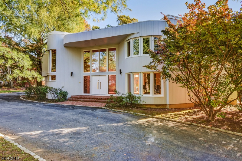 Spacious New renovated Contemporary 6 bedrooms, 7.1 baths in the prestigious Forest Park. Grand entrance with soaring ceilings and windows looking out on a country club backyard with pool. Circular drive w/ 3 car gar ,Marble tiles, hardwood floors, 2 sided fireplace from living room to family room, New kitchen with center island and separate eating area with sliders to a huge deck, tremendous master suite with his and hers bathrooms and over sized closets, finished basement that has an outside sliding door entrance. MUST SEE!!!