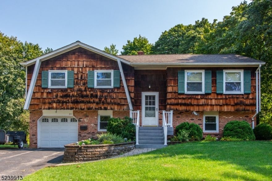 Move in condition bilevel in fantastic subdivision, close to high school.  Paver walk-way and front porch leads to living room with formal dining room, featuring hardwood floors, open to kitchen with movable center island.  White kitchen with recessed lighting, stainless appliances including gas range, microwave, fridge and dishwasher with sliders leading to deck.  Lots of storage with pull down stairs to attic.  Ceramic tile full bath with vanity and pedestal sink, spacious primary bedroom and two additional bedrooms complete the upper level.  Lower level includes laundry with washer and dryer, full bath with stall shower, family room outfitted for woodburning stove and 4th bedroom with double closet.  Garage is oversized with room for 1.5 cars with opener and workbench area.  Mostly level and usable backyard, great for entertaining.  Just blocks to downtown Newton with theaters, restaurants, shopping and more!