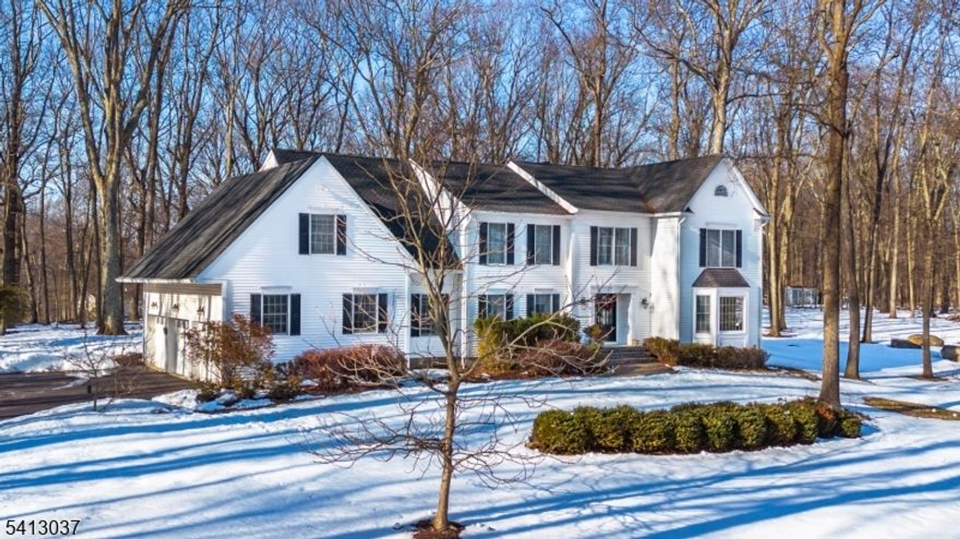 Exceptional 4 bedroom, 3 1/2 bath stately Colonial set on 1.84 acres in desirable neighborhood in Long Valley. Tucked at the end of a quiet cul-de-sac on a wooded lot with lovely seasonal views, this home offers elegance, comfort, and privacy. An inviting foyer with double closets leads to formal living and dining rooms. The dramatic two-story great room features a cathedral ceiling, new skylights, and a masonry wood-burning fireplace with new insert. The refreshed eat-in kitchen offers quartz countertops, newer stainless steel appliances, and storage. Hardwood floors, crown molding, and natural light enhance the home's warmth and charm. First floor den/office perfect for remote work or guest area, along with an updated powder room and laundry. Upstairs, the spacious primary suite includes two walk-in closets and en-suite bath. Three additional bedrooms, two updated full baths and a bonus room suitable for a variety of needs round off the 2nd floor. The finished basement offers versatility - ideal space for a home office, fitness area or hobbies, plus storage including cedar closets. Additional highlights include a 3 car garage, a large shed with electric, and ample driveway parking. Outdoor space is equally impressive with a bluestone patio with a built-in grill, large yard and firepit - perfect for entertaining. Located in Long Valley, known for its highly rated schools and convenient access to major highways, recreation, shopping, and dining. Property being sold as-is.