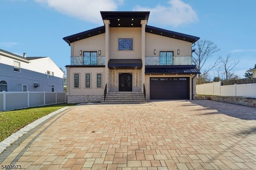 Welcome home to this expansive New Construction 5-bedroom, 3-bathroom Colonial, ideally situated on a quiet residential street. A dramatic two-story entry foyer sets an elegant tone and opens to beautifully proportioned living spaces designed for everyday comfort and entertaining. The gracious living room is filled with natural light from oversized windows and flows seamlessly into the formal dining room perfect for intimate dining or larger gatherings. The eat-in kitchen is the heart of the home, featuring custom cabinetry, double wall ovens, stainless steel appliances, and a center island with bar seating. A large cased opening connects the kitchen to the sunlit family room, where soaring ceilings, expansive windows, and a gas fireplace create an inviting atmosphere. First-floor bedroom and full bathroom offer accommodations for guests. Upstairs, a cozy den leads to the primary suite with walk-in closet and en suite. Three additional generous bedrooms, two with walk in closets, a full bathroom, and laundry room complete the level. The fully finished walk-out basement provides exceptional flexibility, ideal for a second family room, gym, home office, or hobby space. Outdoors, sliding glass doors lead to a spacious deck and patio, perfect for entertaining, grilling, and al fresco dining. The backyard offers ample space for recreation and features an above-ground pool for summer enjoyment. A 2-car attached garage and generous driveway parking complete this exceptional home.