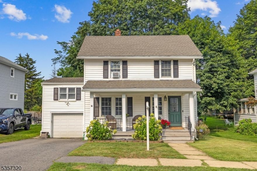 Lemonade front porch colonial on neighbor friendly street, a stone's throw to town pool and high school.  Laminate floors on first floor, updated white kitchen, family room with stone fireplace and wood-burning stove insert (sold as-is, not used), sliders to deck with gorgeous shade tree over deck and fenced yard.  Two bedrooms and full bath up main staircase and 3rd bedroom with separate staircase from rear of home has own 1/2 bath.  Full basement is walk-out and has laundry with washer and dryer included.  Just blocks to everything Hackettstown has to offer - Centenary University, shopping, fantastic dining, Belgian chocolate shop, salons, NJ Transit train station and more!