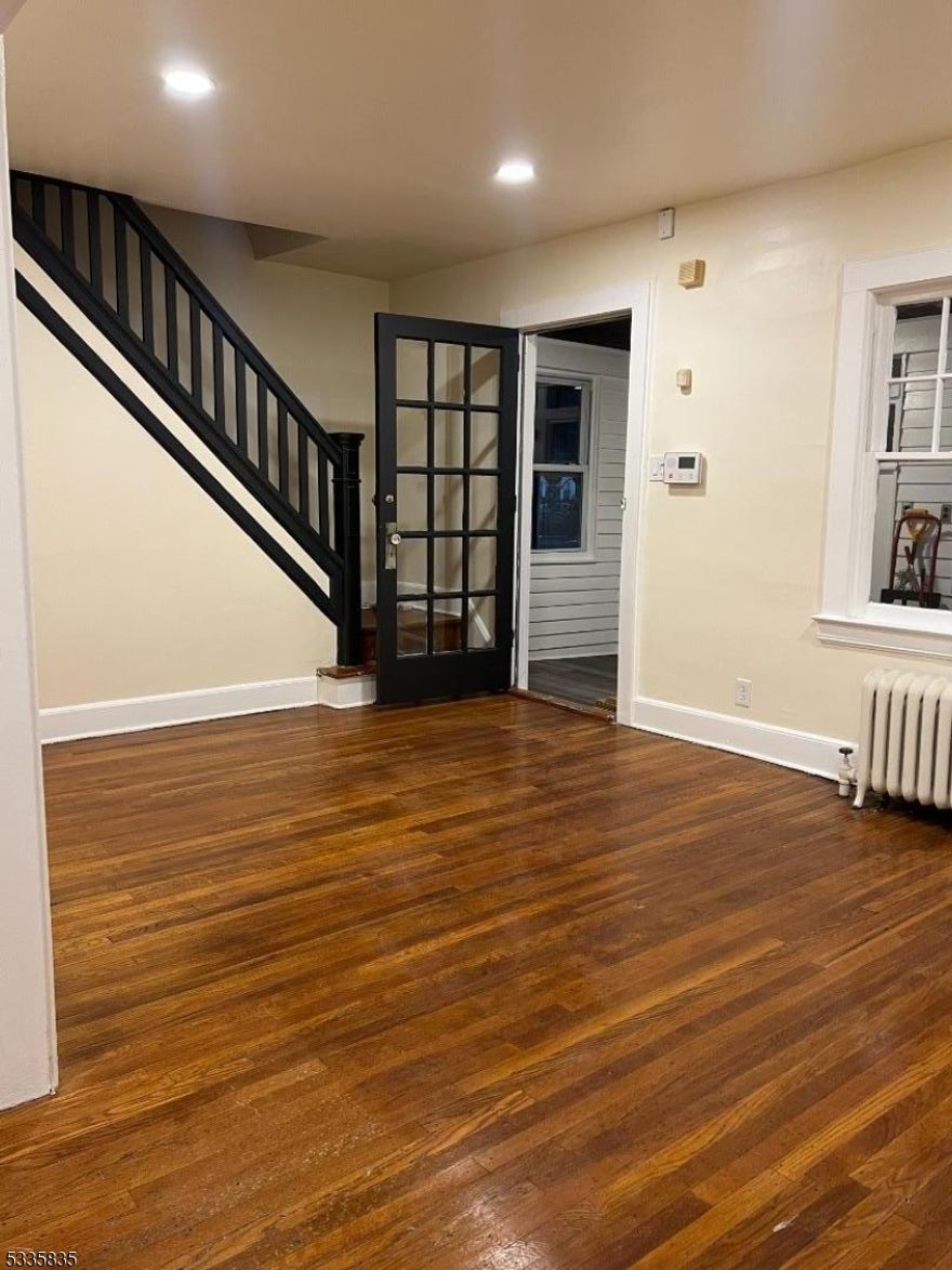 Spacious colonial home with renovated spaces that include recess lighting on the main level and the rec room, bright kitchen and stainless-steel appliances, 2nd fl. main bath, recreation room with full bath, 3-season porch.  Unfinished attic for storage. Off-street parking and rear deck and yard.  Convenient to stores and transportation. Tenants responsible for utilities, snow removal and yard maintenance.