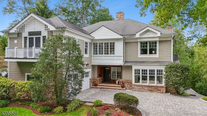 Move right into this superbly upgraded & conveniently located 5 Bed, 4 Full Bath custom home nicely positioned on a beautifully landscaped lot. This meticulously cared-for home combines architectural details w/ desirable modern amenities & thoughtful design. The spacious foyer welcomes you into the home & leads you to the large DR w/ French doors leading outside & an elegant LR w/ pocket French doors, gas fireplace & bay window. The FR w/ specially designed study/office space also leaves ample room for entertainment, while a full bath off the FR & double doors allow for a 1st-flr BR/BA option. The chef's kitchen with wood cabinets, quartz counters & high-end appliances opens to a deck & beautifully landscaped gardens, perfect for entertaining. Enjoy the 2-car garage conveniently located off the kitchen, w/ a mudroom & laundry room creating easy use & convenient flow. Consistent hardwood flooring, wide hallways, custom built-ins, & sun-filled large windows create warmth & flow. An oversized window seat at the top of the stairs exhibits the home's true charm prior to entering its 5 bedrooms each w/ huge closets. The primary suite impresses w/ soaring ceilings, private balcony, California Closets, & a spa-like bath. The LL offers a spacious rec room, full bath, & abundant storage. With modern updates, low-maintenance systems & impeccable style, this home is truly move-in ready. The house is just moments from downtown restaurants, shopping, NYC train & top-rated Summit schools.