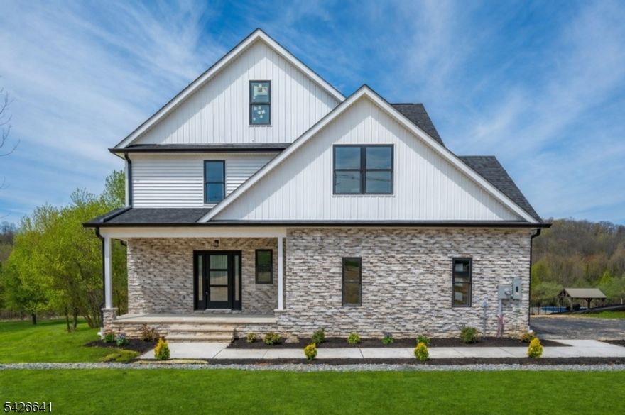 Brand new construction home in Hardyston offering a main-level primary suite, open-concept layout, designer kitchen, spacious living areas, and a fully finished basement with bath. Upstairs includes additional bedrooms and a versatile loft, ideal for a home office, den, or flex space. The home backs to many acres of preserved land, creating a scenic and private backdrop. Enjoy a lifestyle surrounded by golf, resort amenities, dining, outdoor recreation, and beautiful natural scenery, all while remaining convenient top-schools, shopping, and everyday needs. Located across from Ballyowen Golf Club and near Crystal Springs Resort and convenient to Route 23, Route 94, This home offers comfort, style, and a setting that makes everyday living feel like a retreat. Schedule your In-Person or Virtual Showings now. Taxes listed do not reflect the completed home. Property has not yet been fully assessed. Buyer to verify future taxes with the municipality/tax assessor.