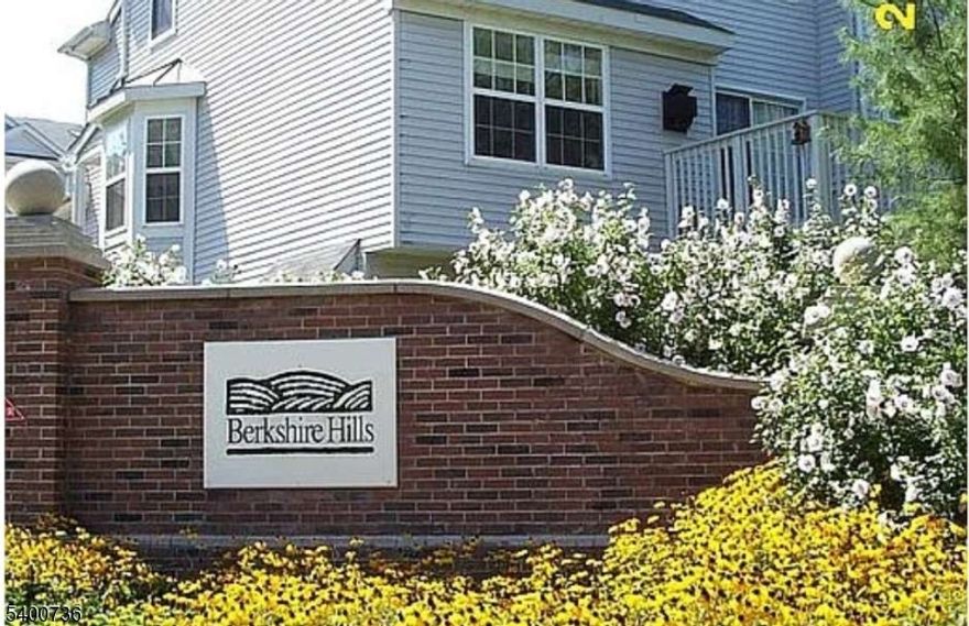 Premium End Unit with 3 BR, 2.5 bath in desirable Berkshire Hills community in Denville, NJ. Main floor has spacious living room with gas fireplace, dining room with bay windows, spacious kitchen with granite countertops and stainless steel appliances, and 1/2 bath. 2nd floor has Primary bdrm with cathedral ceiling and skylights, en-suite with jetted tub and stall shower. 2nd and 3rd BRs and full bath along with laundry room complete the top floor. 2 car garage has newer insulated garage door, Large basement has fully finished walk-out recreation room with sliders to patio. *All windows being replaced prior to close. Vibrant, friendly community with swimming pool and playground. Renowned Denville schools, only couple minutes drive to NYC Bus, Route 10 and Route 46. Buyers agents welcome. Available to show by appointment only.Windows - all new being installed January 2026 HVAC - upstairs unit 2022, downstairs unit 2012. Kitchen appliances - new 2019 Garage door - new in 2020