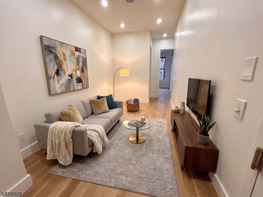 Beautiful first-floor 2-bedroom, 1.5-bath apartment located in the highly desirable Jersey City Heights. This pet-friendly home features a private backyard, in-unit washer and dryer, central heating and cooling, and a modern kitchen equipped with stainless steel appliances, including a dishwasher. Spacious layout with contemporary finishes throughout, and conveniently located near shops, restaurants, and transportation. No parking available. Applicants must have a minimum 620+ credit score. A completed rental application, proof of income, and a credit/background check are required for all applicants. All Units have been Virtually Staged.
