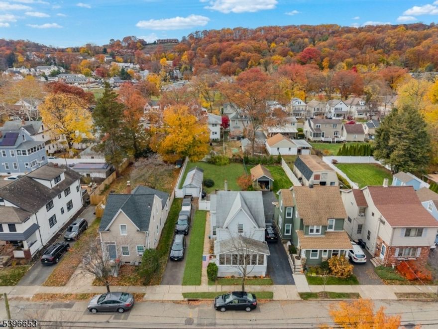 Charming Colonial in the Heart of Hawthorne! Welcome to 96 2nd Ave a beautifully maintained 3-bedroom, 1.5-bath Colonial nestled in one of Hawthorne's most desirable neighborhoods. This classic home perfectly blends timeless charm with modern comfort, featuring hardwood floors, a formal dining room, and a modern eat-in kitchen with granite countertops, maple cabinets, and ceramic tile flooring. Natural light fills the bright living areas, including a enclosed porch perfect for relaxing or entertaining. Situated on a spacious 100x150 fenced lot, the property offers a lovely backyard with a patio, a large driveway, and a detached garage for added convenience and storage. A full basement provides excellent storage or expansion potential. Centrally located close to parks, schools, shops, and NYC transportation, this move-in-ready home offers classic Colonial style, solid quality, and a location that fits every lifestyle.