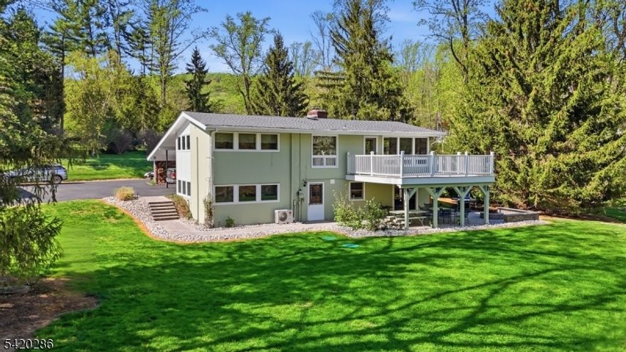 Welcome to this stunning contemporary colonial set on 6 picturesque acres in the heart of Hunterdon County, farmland assessed & complete w/ sheep that convey w/ the property.A rare blend of modern updates & country charm, this 4-bed, 2-bath home delivers the lifestyle buyers are searching for. Commuters will love the proximity to the Whitehouse Sta. NJ Transit rail line & easy access to Route 78, putting major employment corridors well within reach. The heart of the home is an updated kitchen featuring quartz countertops & SS appliances. Entertain effortlessly in the dining room w/ access to a covered patio, or gather in the soaring cathedral-ceiling living room by a wood-burning stove w/ a Trex deck just beyond the door. The family room offers a cozy wood-burning fireplace insert, perfect for cool NJ evenings.The main hall bath was tastefully updated 6 years ago, adding a fresh, modern feel to the home's second floor. Major updates are already done: new roof (2025),new septic holding tank (2025),and a low-maintenance Trex deck installed 7 years ago give buyers confidence & value from day one. Outside, the property truly shines. A detached garage w/ workshop, attached 2-car carport, & several outbuildings provide exceptional storage & utility. A serene stream winds through the acreage,& a large patio w/ firepit completes this entertainer's dream.Whether you're craving a farm, a private retreat, or simply space to breathe, all within easy reach of the city, this one delivers.