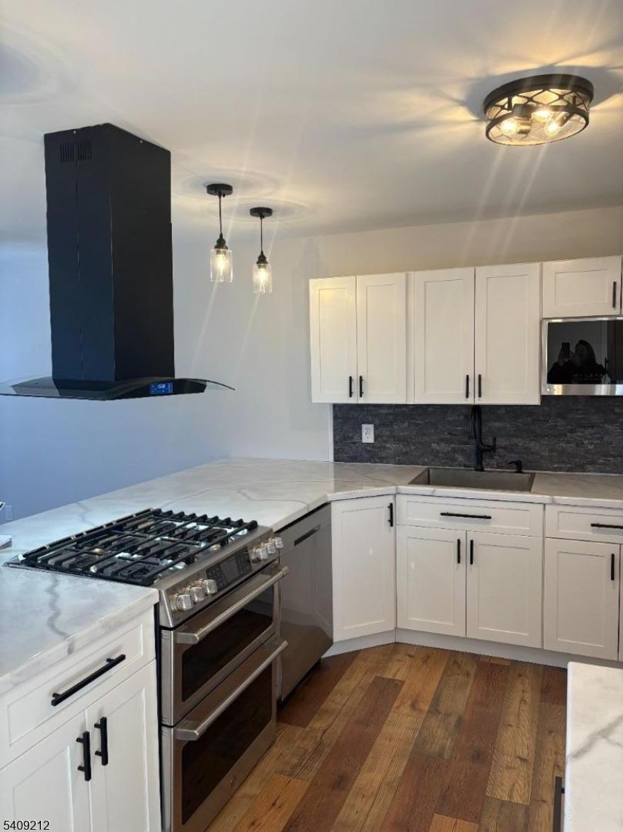 Experience the ultimate resort lifestyle in this fully renovated, ski-in/ski-out condo, move-in ready and designed for both enjoyment and income. The complete interior renovation was finished in August 2025, featuring modern designer finishes throughout. The brand-new kitchen offers stainless steel appliances, custom countertops, a large breakfast bar, and abundant cabinetry- ideal for entertaining after a day on the slopes or the golf course. The open-concept dining and living areas create a bright, welcoming space to relax and unwind. The main level includes a beautifully updated bathroom, a nicely sized bedroom, and a convenient in-unit washer and dryer. The lower level features a spacious recreation room, a brand-new full bathroom, and a stylish barn door leading to an oversized primary bedroom with sliding glassdoors and a walk-out to your private deck. Whether you're seeking a weekend getaway, full-time resort living, or a high-demand investment property, this unit delivers, with the slopes just steps away.